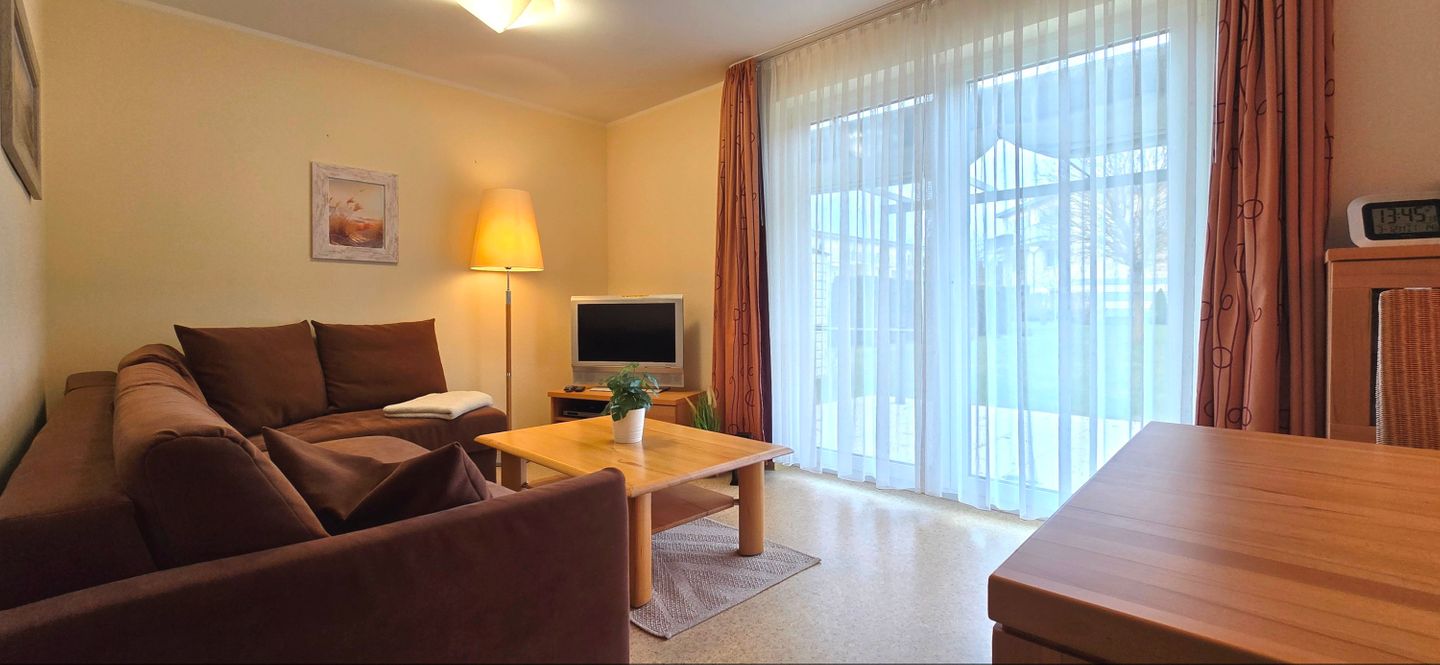  Ferienwohnung KWE 32EG Graal-Müritz Küstenwald - Wohnzimmer