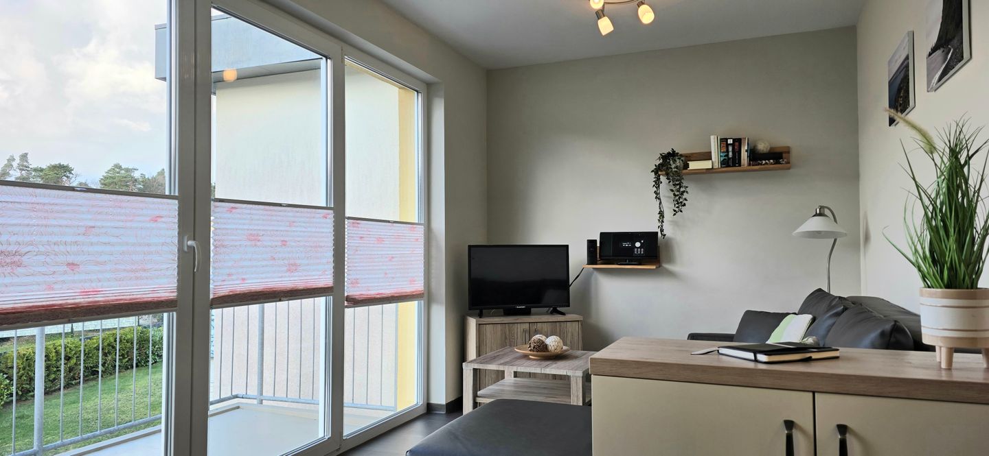  Ferienwohnung KWi 74 OG "Lundi" Graal-Müritz Küstenwald - Wohnzimmer