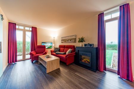 Resort Deichgraf Resort Deichgraf 27-05 Wremen - Wohnbereich mit Flatscreen-TV