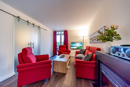 Resort Deichgraf Resort Deichgraf 27-05 Wremen - Wohnbereich mit Couch
