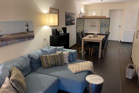 Resort Deichgraf Resort Deichgraf 27-12 Wremen - Wohnzimmer mit Sitzbereich