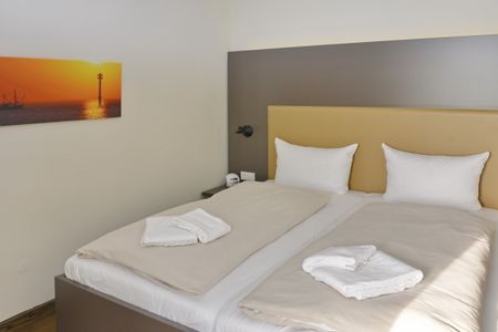 Resort Deichgraf Resort Deichgraf 27-01 Wremen - Schlafzimmer mit Doppelbett