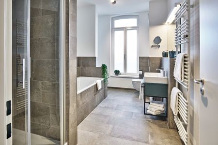 Lüttjeod Apartmentvilla Lüttjeod Apartmentvilla 15 Langeoog - Badezimmer mit Badewanne und Dusche