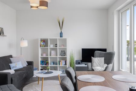 Weiße Villen Weiße Villen 1-11 Boltenhagen - Wohn-Essbereich mit Couch, Sessel und Esstisch