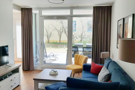DünenResort Binz DünenResort Binz 413 Rügen - Wohn-Essbereich mit Couch