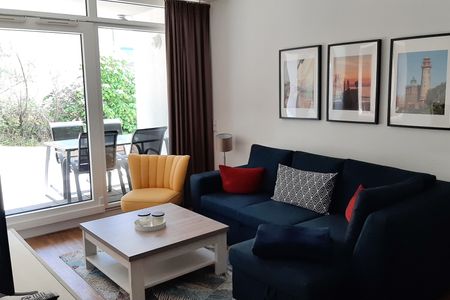 DünenResort Binz DünenResort Binz 413 Rügen - Wohn-Essbereich mit Couch