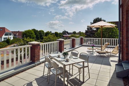 Lüttjeod Apartmentvilla Lüttjeod Apartmentvilla 08 Langeoog - Balkon mit Gartenmöbeln