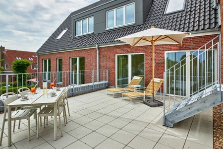 Lüttjeod Apartmentvilla Lüttjeod Apartmentvilla 09 Langeoog - Terrasse mit Gartenmöbeln