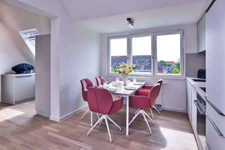 Lüttjeod Apartmentvilla Lüttjeod Apartmentvilla 16 Langeoog - Wohn-Essbereich mit Esstisch und Sitzgelegenheit