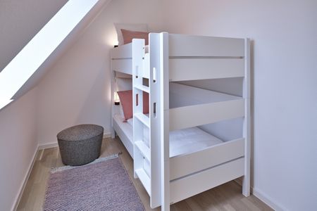Lüttjeod Apartmentvilla Lüttjeod Apartmentvilla 16 Langeoog - Schlafzimmer mit Etagenbett