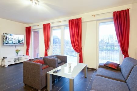 NordseeResort Friesland NordseeResort Friesland 51-1-S Schillig - Wohn-Essbereich mit Couch