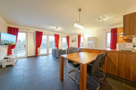 NordseeResort Friesland NordseeResort Friesland 51-1-S Schillig - Wohn-Essbereich mit Esstisch und Sitzgelegenheit