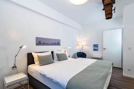 Ohlerich Speicher Ohlerich Speicher 2-09 Wismar - Schlafzimmer mit Doppelbett und Kleiderschrank
