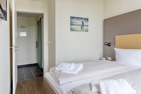 Resort Deichgraf Resort Deichgraf 27-18 Wremen - Schlafzimmer mit Doppelbett