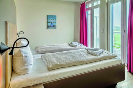 Resort Deichgraf Resort Deichgraf 27-19 Wremen - Schlafzimmer mit Doppelbett