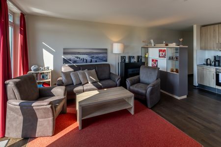 Resort Deichgraf Resort Deichgraf 27-18 Wremen - Wohn-Essbereich mit Couch