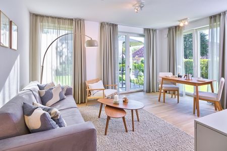 Lüttjeod Apartmentvilla Lüttjeod Apartmentvilla 04 Langeoog - Wohn-Essbereich mit Couch