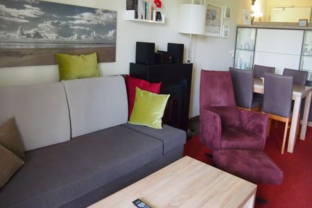 Resort Deichgraf Resort Deichgraf 31-06 Wremen - Wohn-Essbereich mit Couch