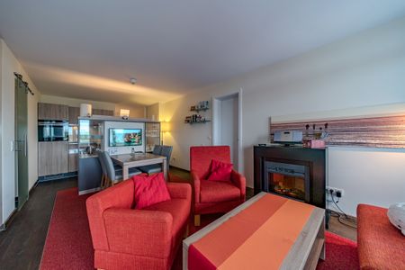 Resort Deichgraf Resort Deichgraf 27-08 Wremen - Wohn-Essbereich mit Couch