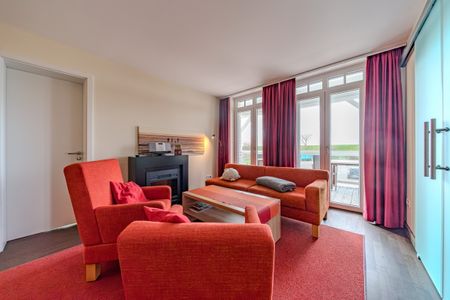 Resort Deichgraf Resort Deichgraf 27-08 Wremen - Wohn-Essbereich mit Couch