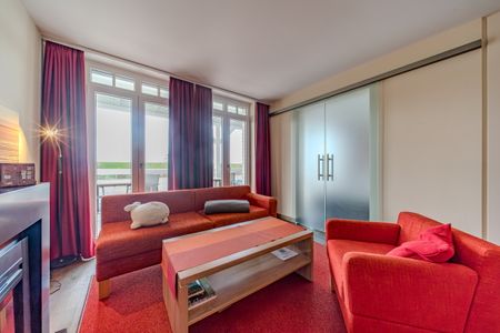 Resort Deichgraf Resort Deichgraf 27-08 Wremen - Wohn-Essbereich mit Couch