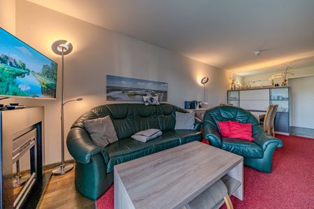 Resort Deichgraf Resort Deichgraf 31-01 Wremen - Wohn-Essbereich mit Couch