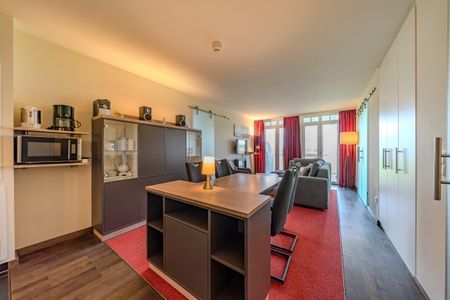 Resort Deichgraf Resort Deichgraf 31-08 Wremen - Wohn-Essbereich mit Couch