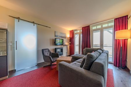 Resort Deichgraf Resort Deichgraf 31-08 Wremen - Wohn-Essbereich mit Couch