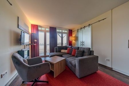 Resort Deichgraf Resort Deichgraf 31-08 Wremen - Wohn-Essbereich mit Couch
