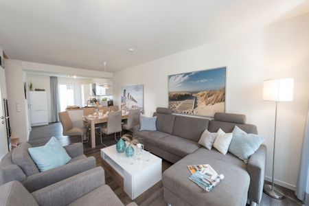 NordseeResort Friesland Ferienhäuser NordseeResort Friesland 38 Schillig - Wohn-Essbereich mit Couch