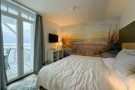 Resort Deichgraf Resort Deichgraf 31-10 Wremen - Schlafzimmer mit Doppelbett