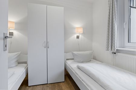 Urlauberdorf Urlauberdorf 33b Boltenhagen - Schlafzimmer mit zwei Einzelbetten und Kleiderschrank