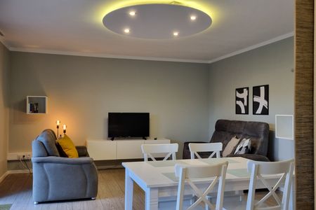 Haus Spökenkieker Loppersum Kiebitzdelle Dünen - Wohnzimmer Sitzecke und Essecke