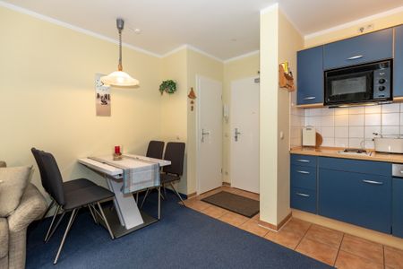 Ostseewelle Ostseewelle 19 Kühlungsborn - Wohn-Essbereich mit Esstisch und Sitzgelegenheit