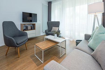 Apartmentvilla Anna See Apartmentvilla Anna See 1-15 Langeoog - Wohn-Essbereich mit Couch