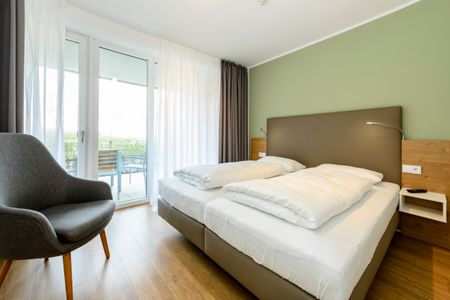 Apartmentvilla Anna See Apartmentvilla Anna See 1-15 Langeoog - Schlafzimmer mit Doppelbett