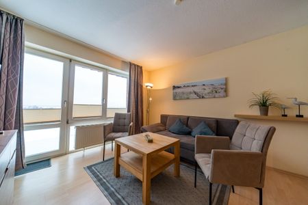 Hus Strandkieker Hus Strandkieker 09 Schillig - Wohn-Essbereich mit Couch