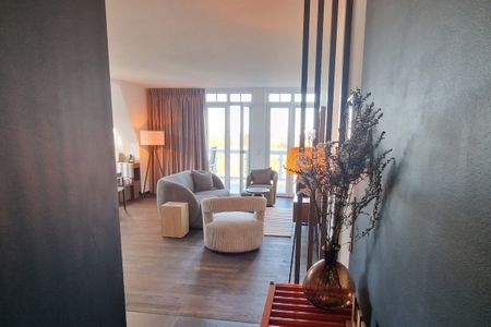 Resort Deichgraf Resort Deichgraf 31-18 Wremen - Wohn-Essbereich mit Couch