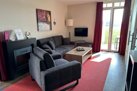 Resort Deichgraf Resort Deichgraf 31-04 Wremen - Wohn-Essbereich mit Couch