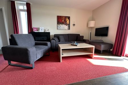 Resort Deichgraf Resort Deichgraf 31-04 Wremen - Wohn-Essbereich mit Couch