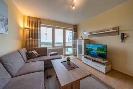 Hus Strandkieker Hus Strandkieker 04 Schillig - Wohn-Essbereich mit Couch