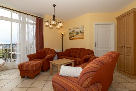 Apartmenthaus Atlantik Apartmenthaus Atlantik 411 Kühlungsborn - Wohn-Essbereich mit Couch