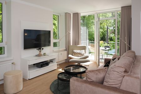 Strand-Park Strand-Park 124 Usedom - Wohn-Essbereich mit Couch und Flatscreen-TV