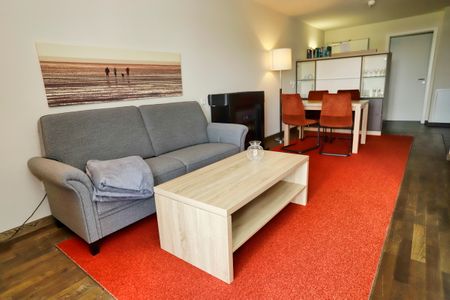 Resort Deichgraf Resort Deichgraf 31-12 Wremen - Wohn-Essbereich mit Couch