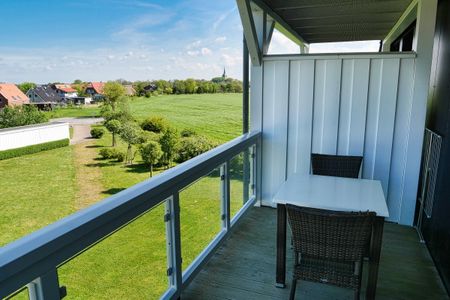 Resort Deichgraf Resort Deichgraf 31-12 Wremen - Überdachter Balkon mit Sitzgelegenheit