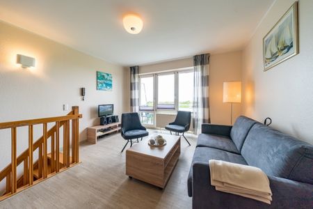 Hus Strandkieker Hus Strandkieker 01 Schillig - Wohn-Essbereich mit Couch
