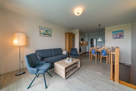 Hus Strandkieker Hus Strandkieker 01 Schillig - Wohn-Essbereich mit Couch