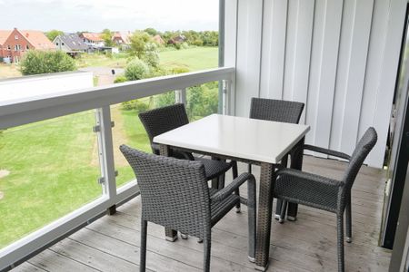 Resort Deichgraf Resort Deichgraf 31-12 Wremen - Überdachter Balkon mit Sitzgelegenheit