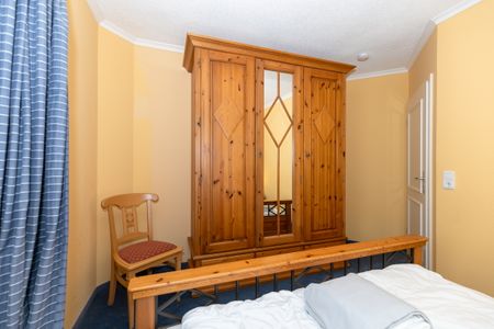Apartmenthaus Atlantik Apartmenthaus Atlantik 318 Kühlungsborn - Schlafzimmer mit Doppelbett und Kleiderschrank