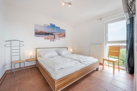 NordseeResort Friesland NordseeResort Friesland 52-4-S Schillig - Schlafzimmer mit Doppelbett